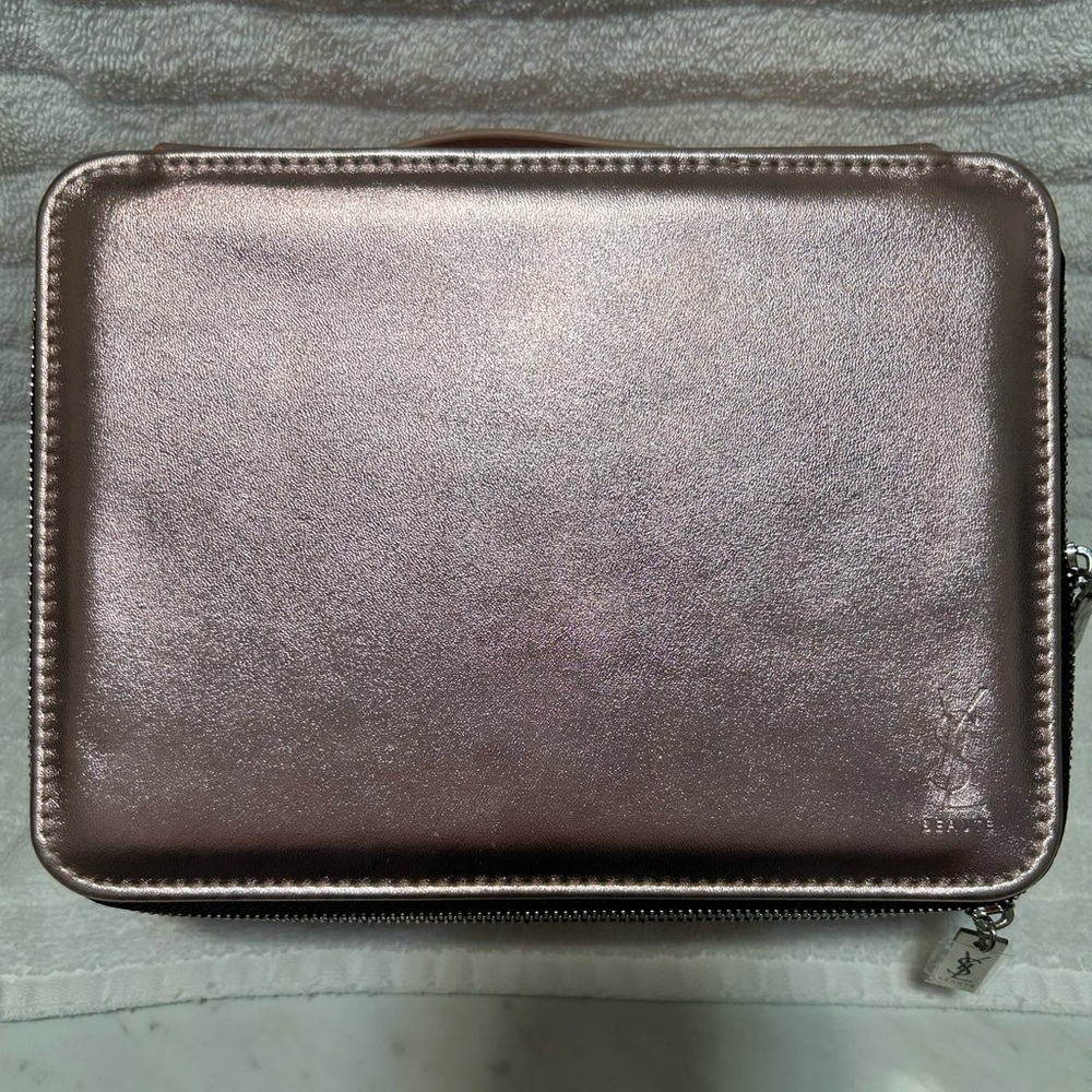 YSL cosmetic bag.  Comes with votive.